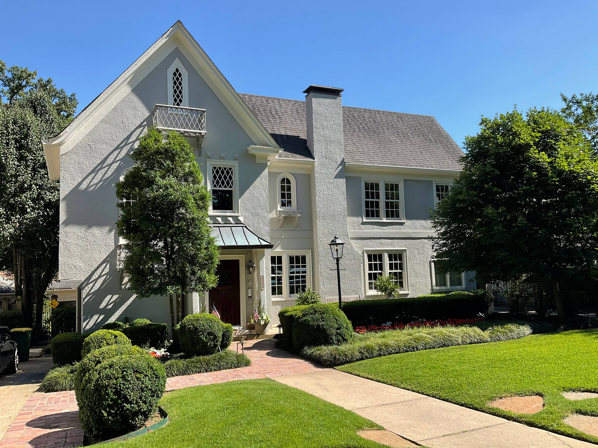 Custom Marvin Windows matched to an English style home with grey stucco