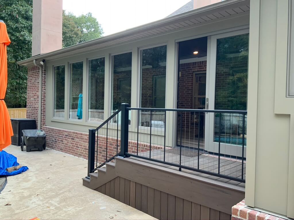 Exterior of new sunroom with floor to ceiling Marvin Windows