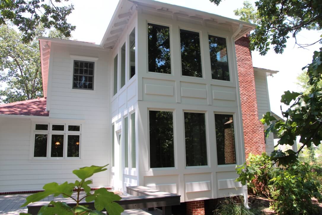 Two Story Sunroom Addition with floor to ceiling windows