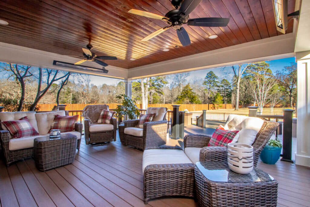 Back deck addition with tongue and groovve wood ceiling and TimberTech flooring. Built in heaters overhead make this a year round deck!